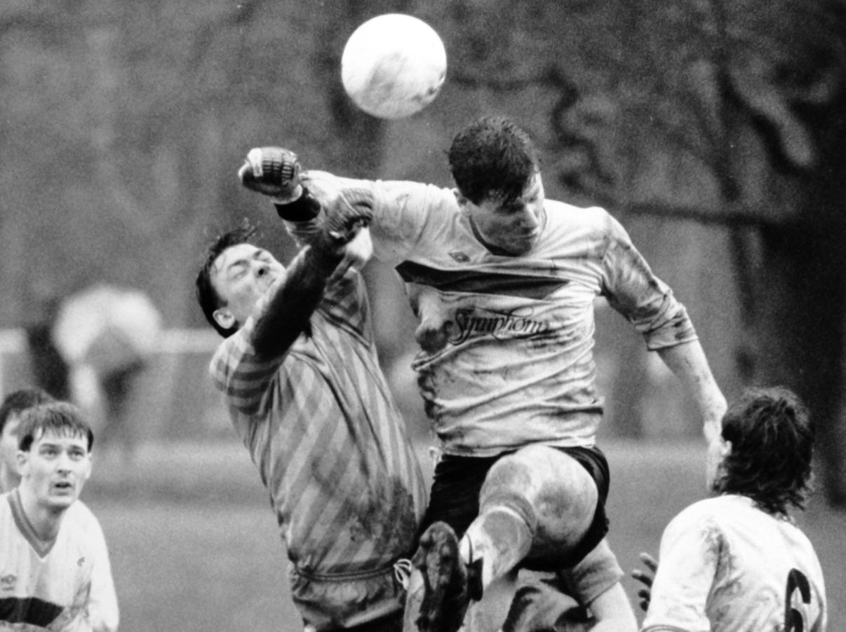 Clive Smythe, of Red Star Symphony, in the thick of the action with Monkbridge goalkeeper Ian Myers.