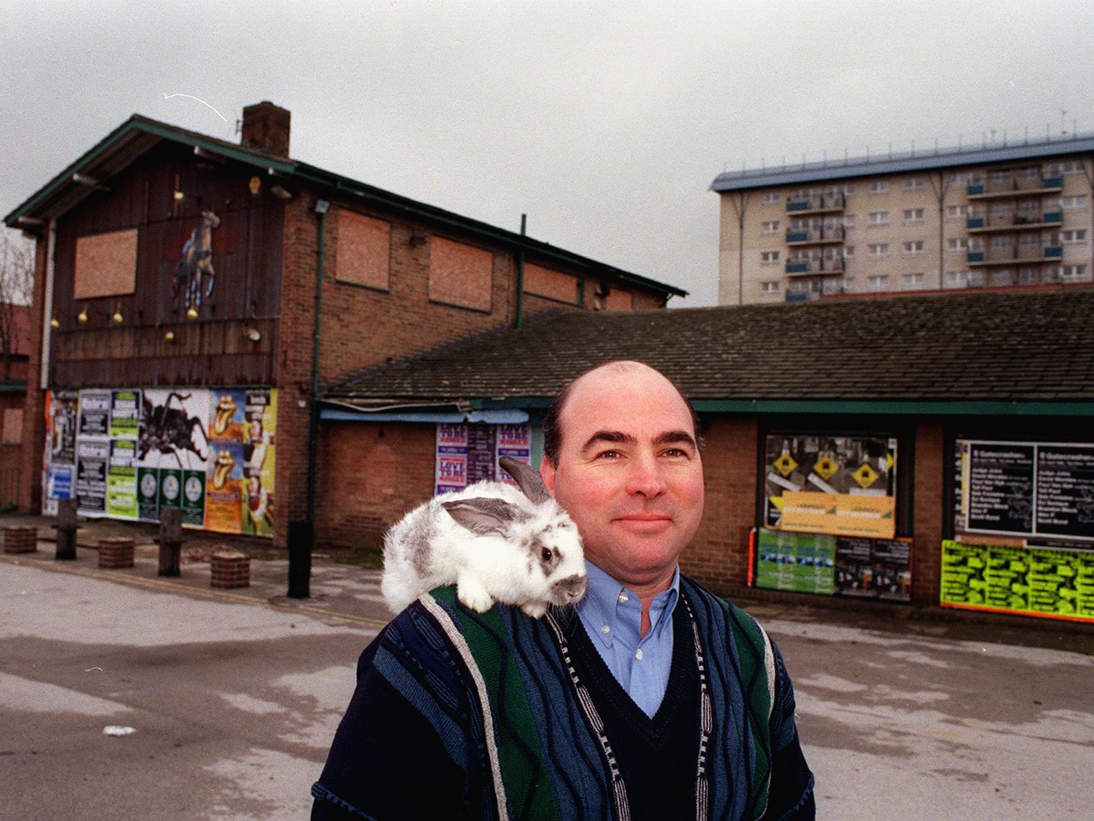 Dale Briggs, of Paws for Thought, pictured outside the former Trotters pub on York Road, Leeds, with a rabbit from his pet shop.