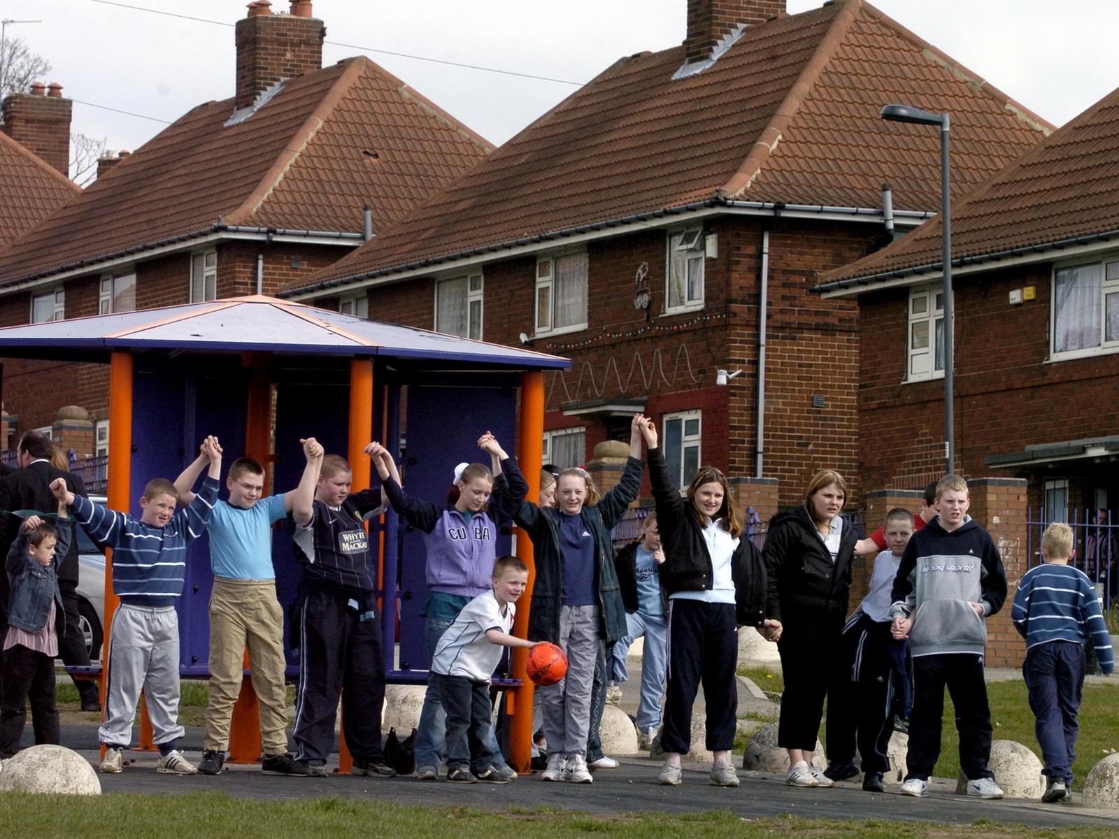 Youngsters gather near one of the new youth shelters on the Halton Moor Estate.