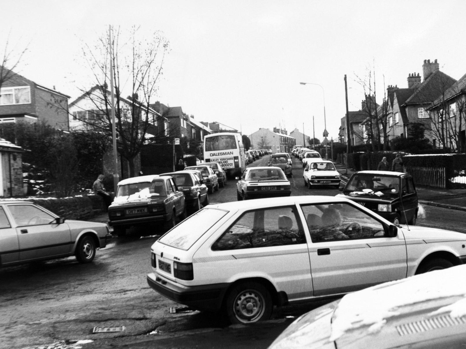 The chaotic scene in Fartown as traffic builds up and vehicles park waiting to pick up pupils from Fulneck School at the end of the school day.