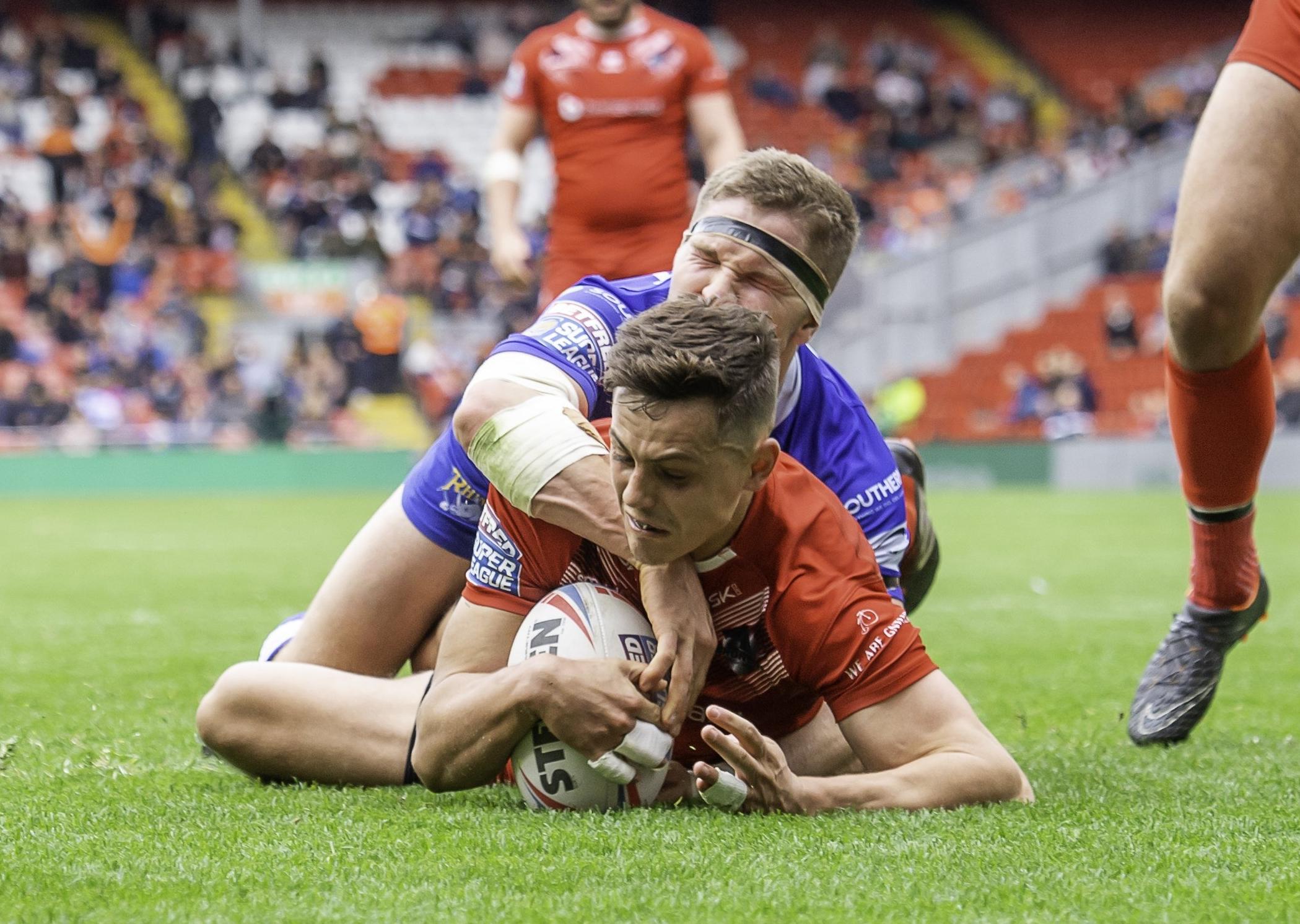 Alex Walker touches down for London against Leeds Rhinos.