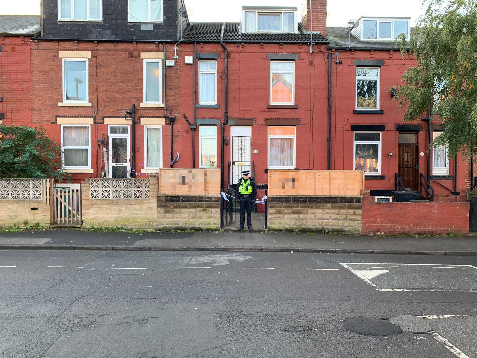 Police outside a house in Harehills after a substance was thrown during a burglary early on Thursday morning