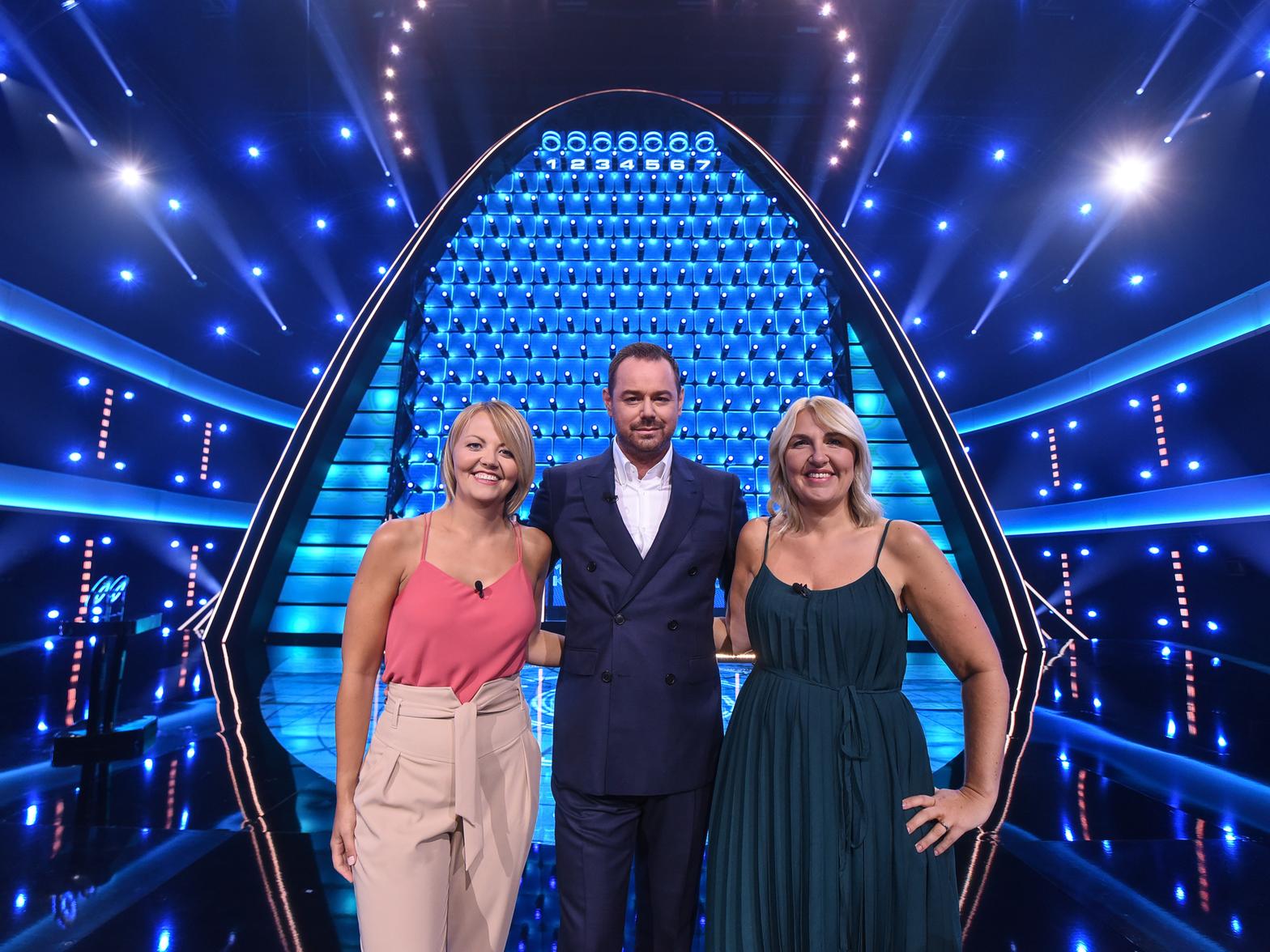 Sisters Helen McDonald and Louise Seymour, from Leeds, with The Wall host Danny Dyer. Credit: BBC.