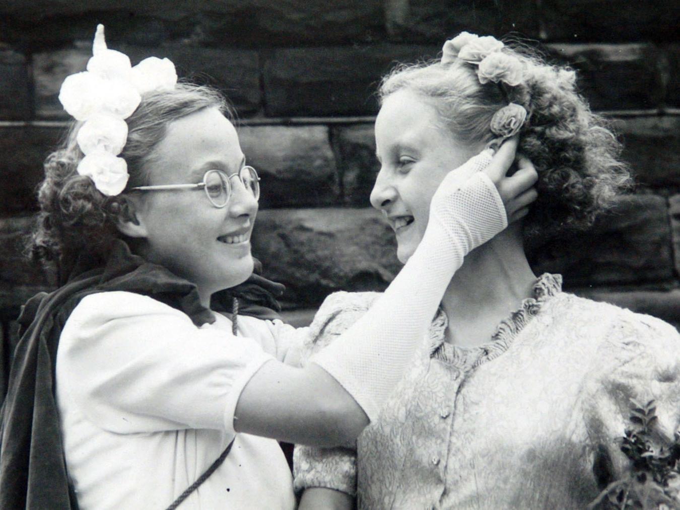 Joyce Britten  who was Holbeck St. Matthew's Children's carnival queen. Pictured with her sister Shirley Barber (right).