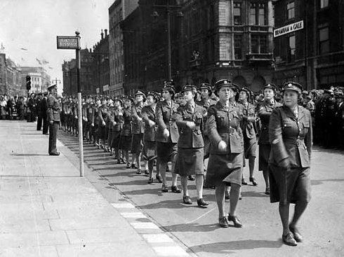 This view shows a march past by WAAF's on The Headrow,