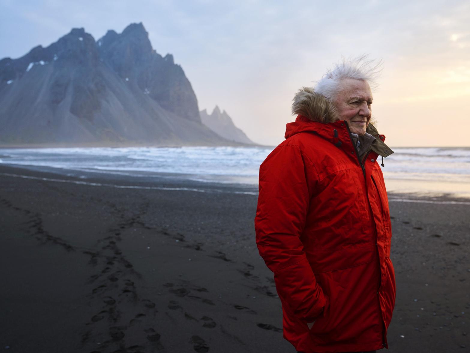 BBC handout photo of Sir David Attenborough on location filming Seven Worlds, One Planet on Stokksnes beach in Iceland.