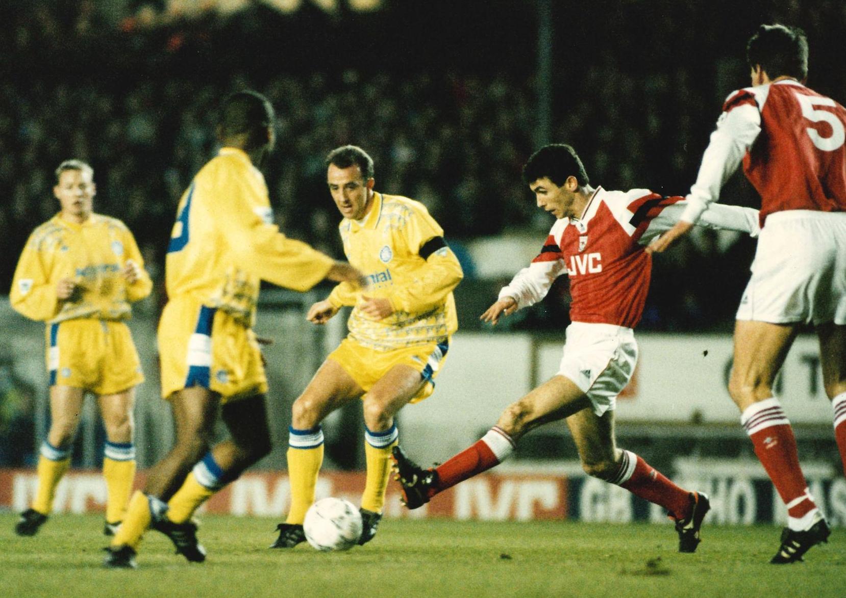 Gary McAllister is challenged by Martin Keown during the first half of the Premier League clash at Highbury.