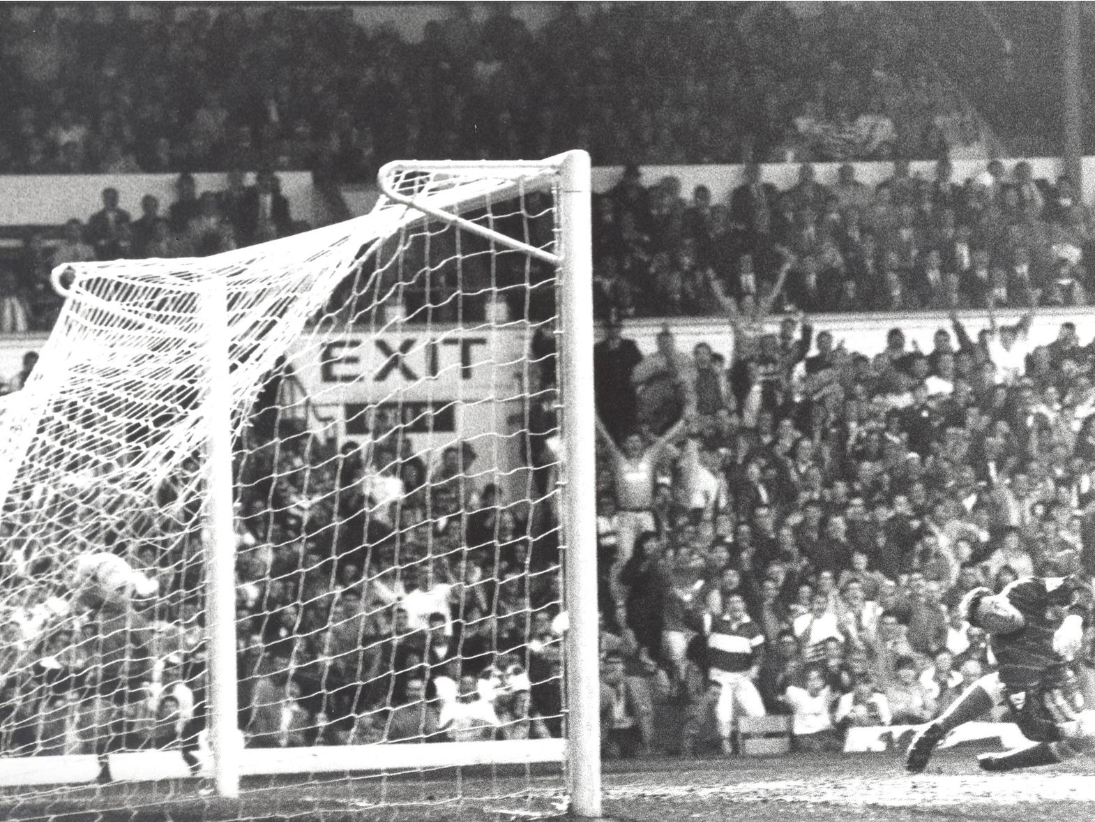 A despairing dive from Tony Coton as David Rocastle's shot hits the back of the net.
