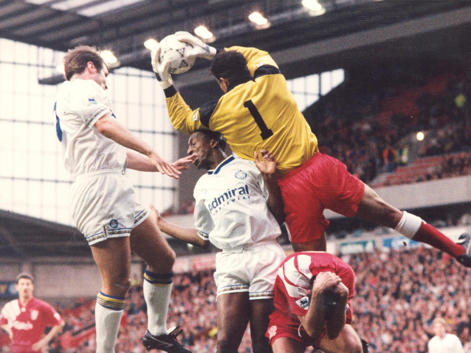 David James plucks the ball from the air under pressure from Chris Whyte and David Wetherall.