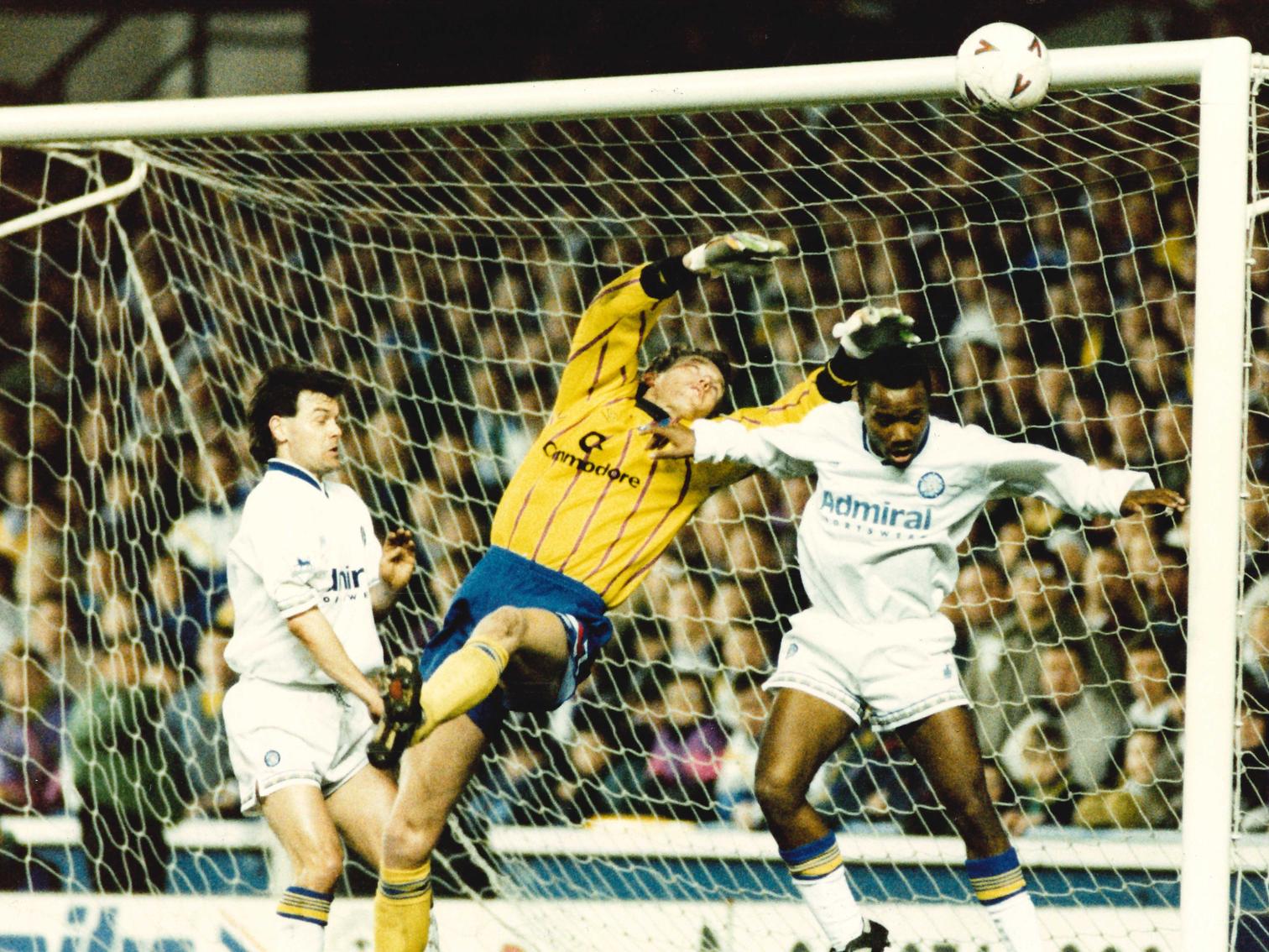Chelsea keeper Dave Beasant turns the ball away as Rod Wallace and Steve Hodge challenge.