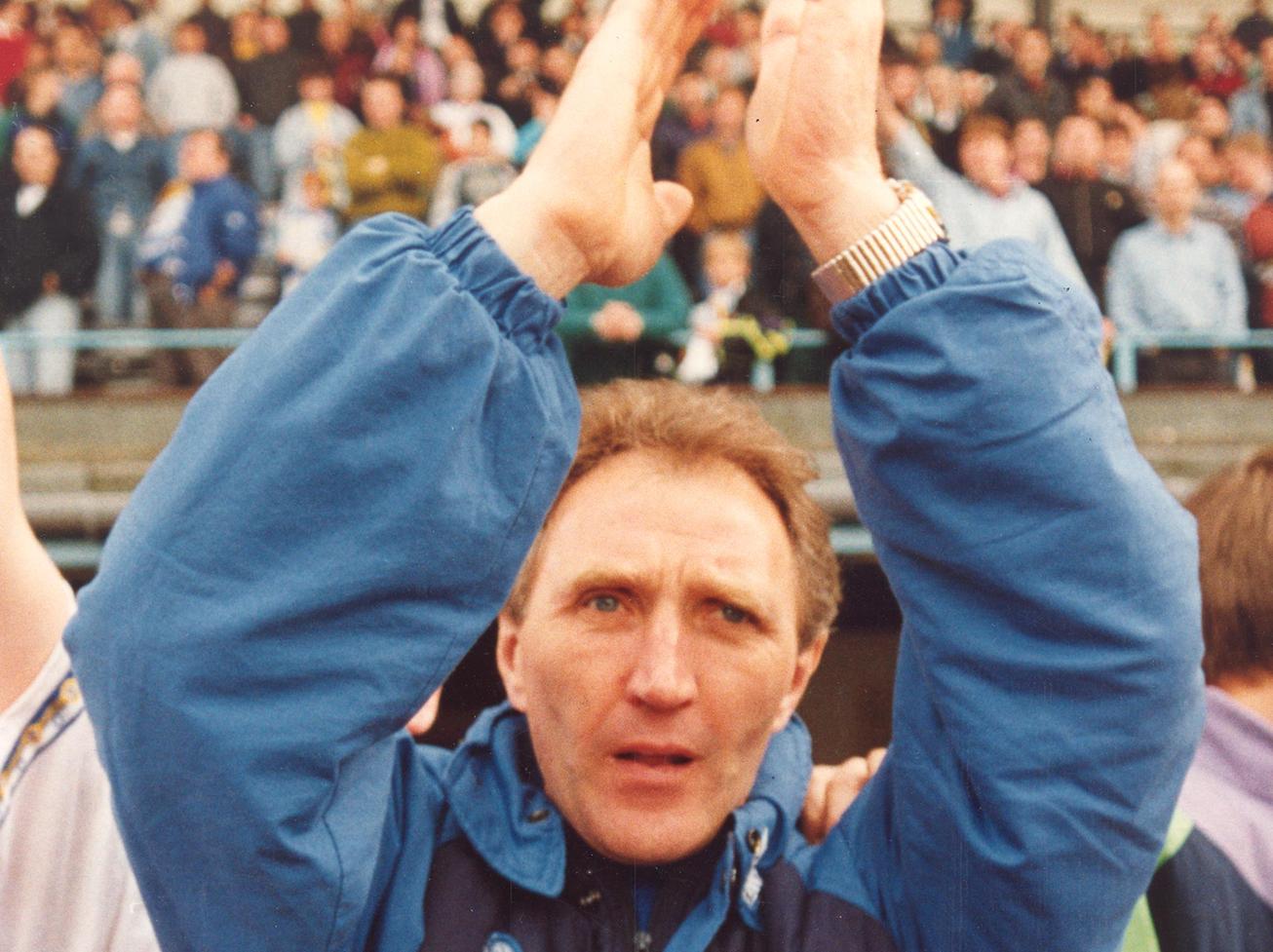 Howard Wilkinson applauds the travelling fans at Highfield Road.
