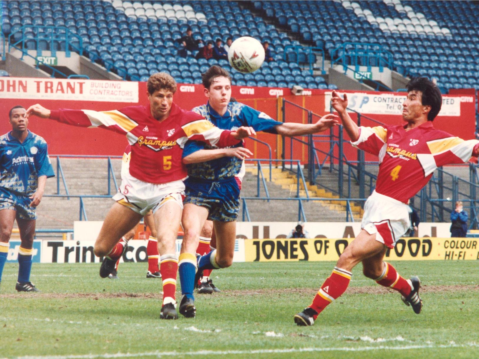 Noel Whelan battles for the ball. Two goals from Chris Whyte, who had Gary Lineker in this pocket, earned United the win.
