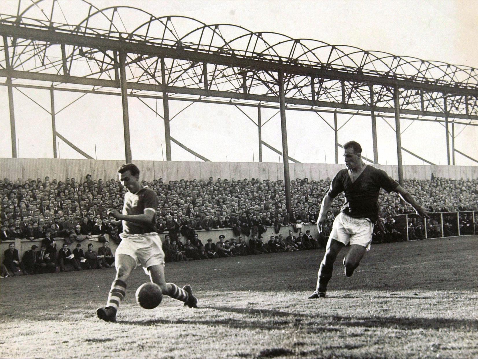 John Charles, in action in the game against Birmingham City at Elland Road soon after the fire that decimated the Main Stand in September 1956.