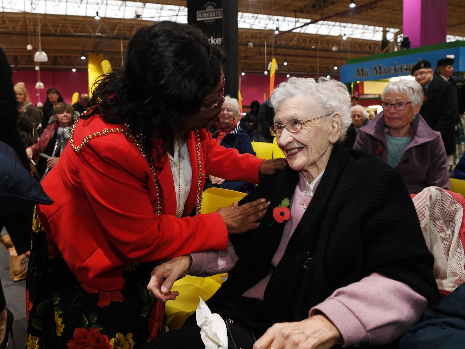The Lord Mayor of Leeds, Coun Eileen Wilson presents the first poppy of the 2019 appeal to Joy Tomlinson, aged 100.