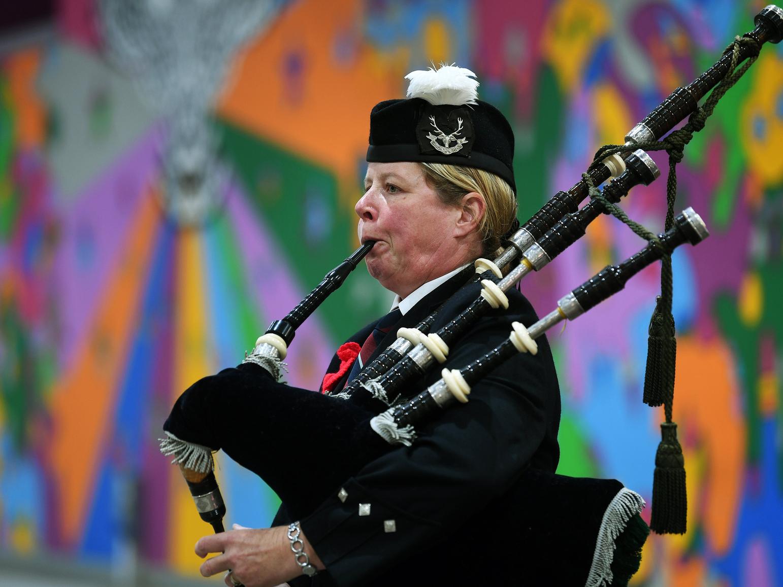 A piper plays at the launch of the 2019 Poppy Appeal in Leeds Kirkgate Market.