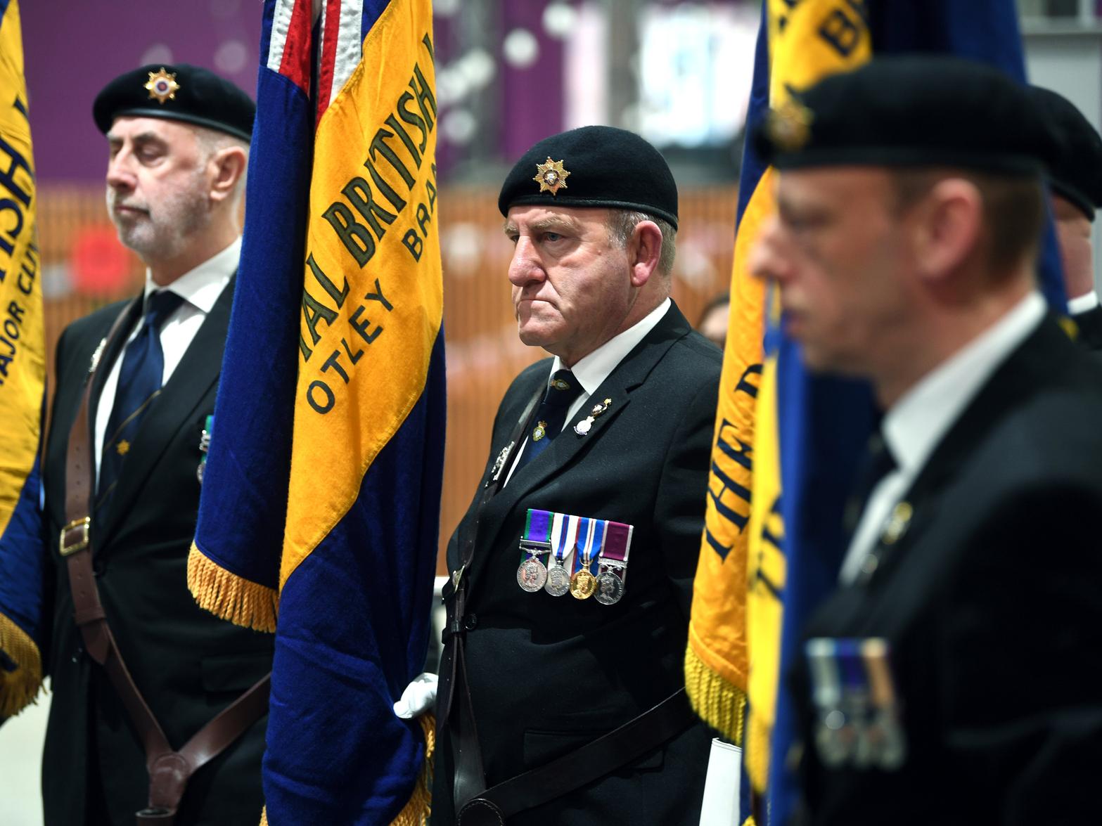 Standard bearers take part in the ceremony.