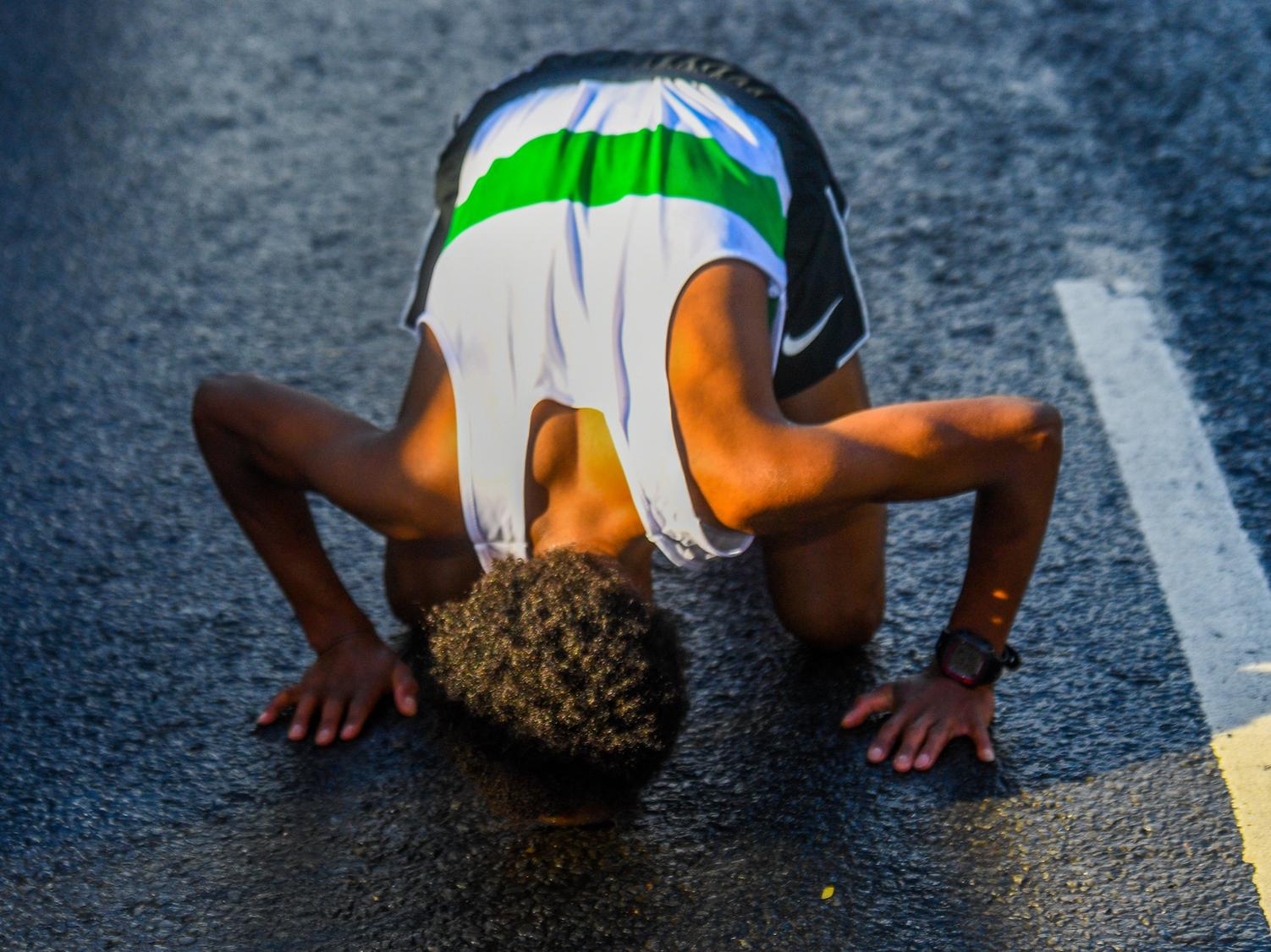 Omar Ahmed was overjoyed to be the first male runner to cross the finish line.