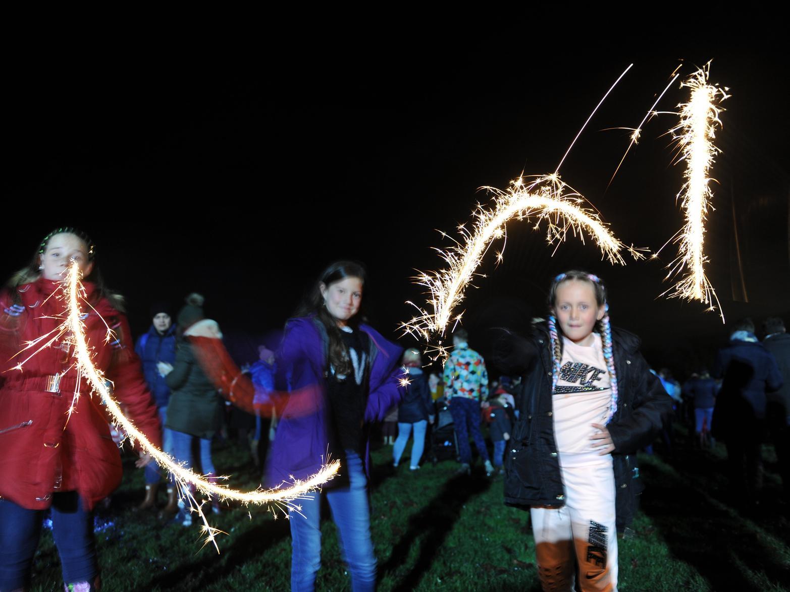 Crystal McDaniel aged 11, Eva Peel aged 11 and Starla McDaniel aged seven with their sparklers.