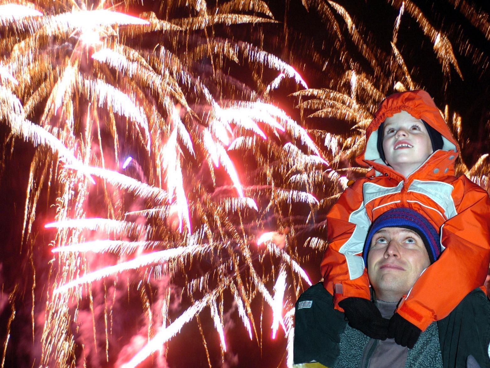 Andrew Wheeler of Horsforth, watches the Roundhay Park firework display with his son Joseph, six.