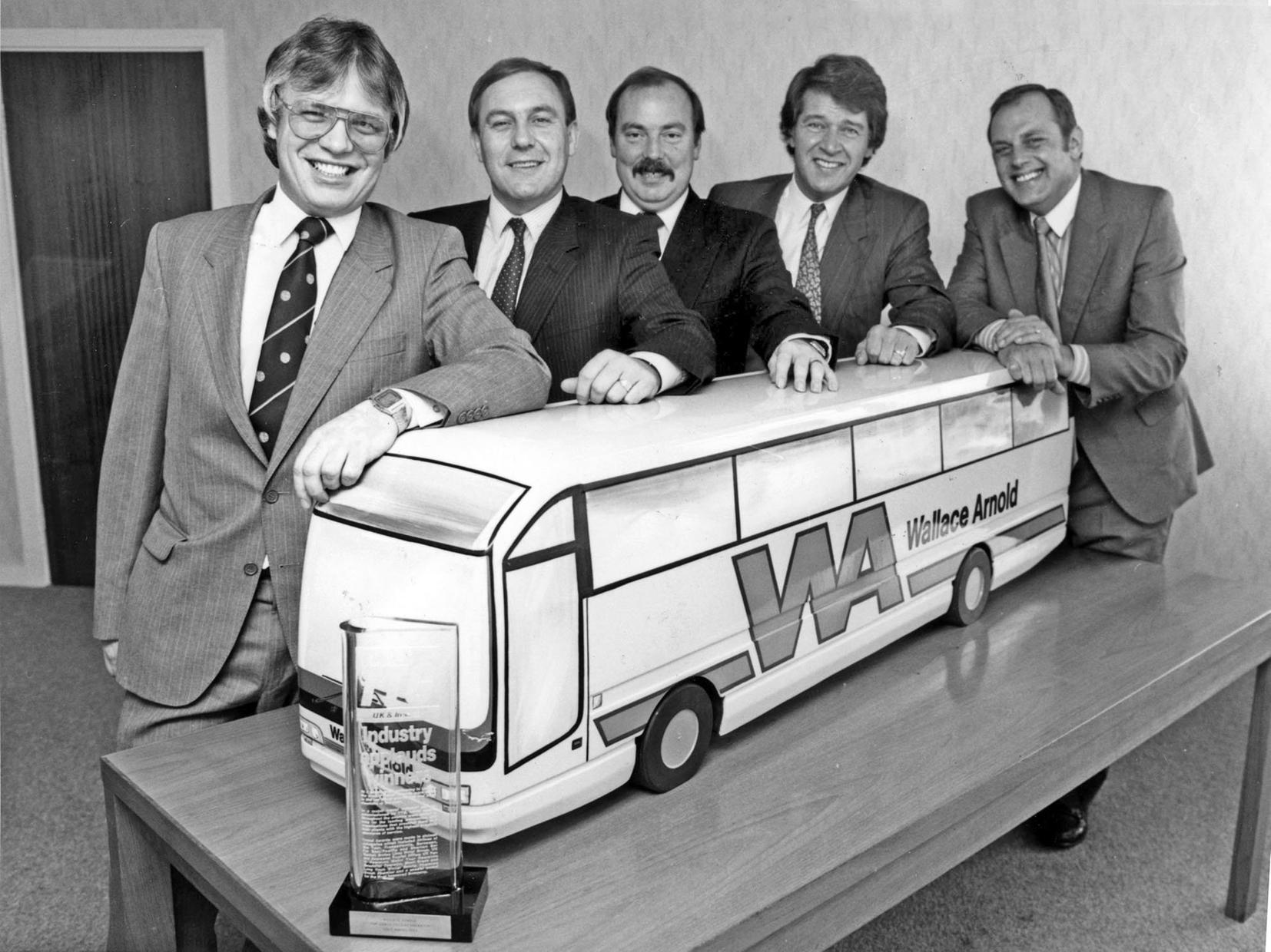 Wallace Arnold directors celebrate winning top coach operator's award in Octoebr 1989.