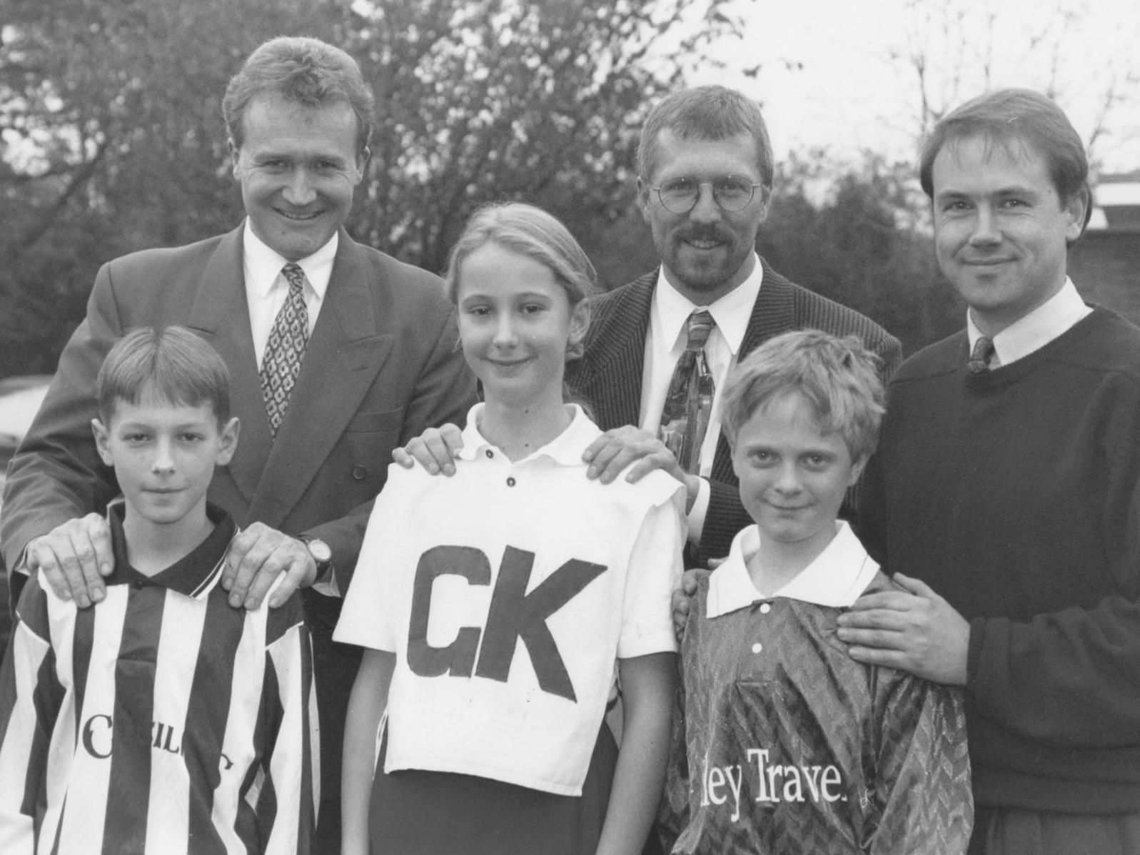 East Ayton School's two football teams and netball team received new strips in November 1996. Pictured handing over the new strips are, left to right, Michael Padgham, from St Cecilia's on Stepney Road, Ian Rhodes, whose daughter plays for the netball team, and Howard from Filey's Travel Shop, with team captains, Joseph Tomlinson, left, Katie Neary, George Coopland.