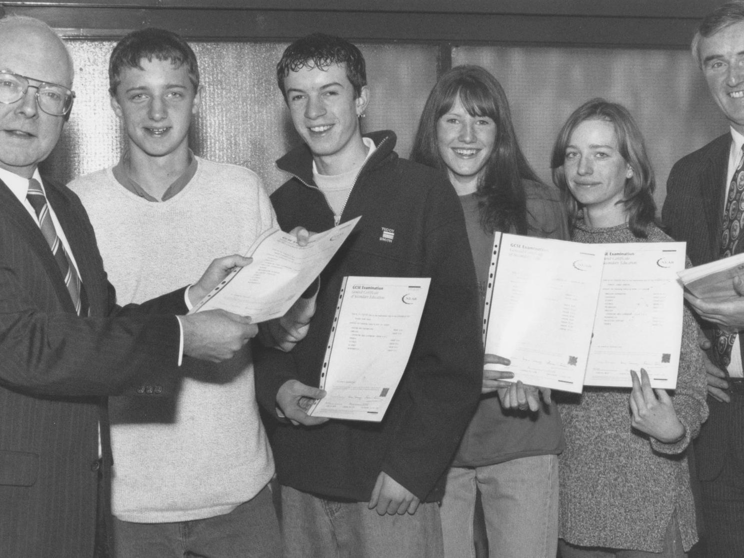 In December 1997 St Augustine's headteacher Keith Bear, left, presented GCSE certificates to former pupils, from left, Timonty Nicholson, Richard Acott, Lesley Horncastle, Rachel Connor. Also pictured is deputy head Roger Cannon.