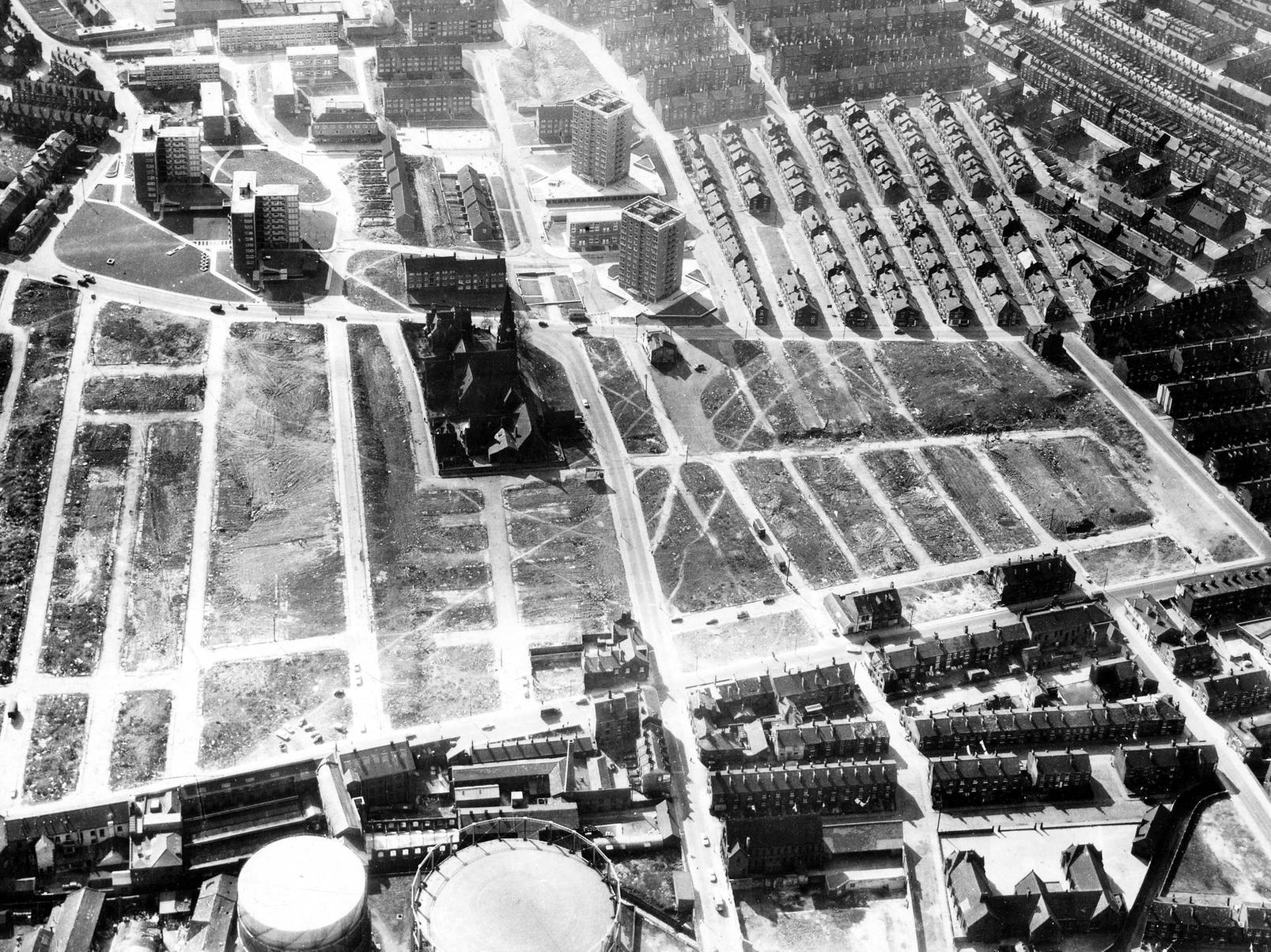 An area where houses have been demolished in line with slum clearance plans. Gasometers at a Gasholder Station on Sheepscar Street North can be seen in the bottom left with Sheepscar Council School bottom right.