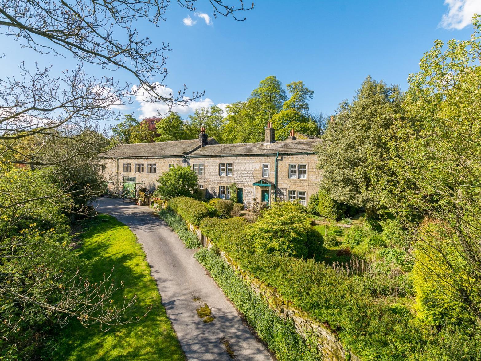 The property consists of two existing dwellings being two and three bedroom respectively which are Grade II listed. They are attached to the former sawmill where planning permission has recently been granted for two No dwellings.