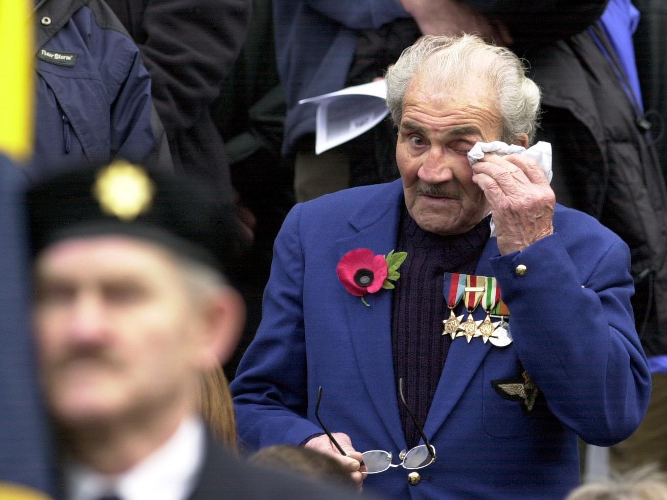 A war vetertan wipes away a tear during the playing of the Last Post.