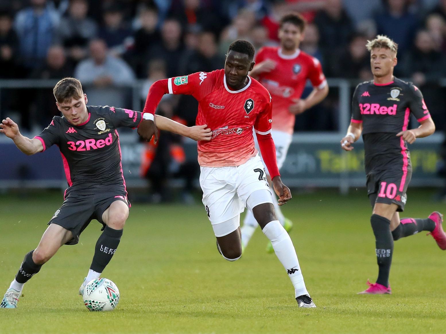 IMPRESSING: Leeds United's teenage defender Leif Davis, left, pictured battling Salford City's Mani Dieseruvwe in August's EFL Cup tie. Photo by Martin Rickett/PA Wire.