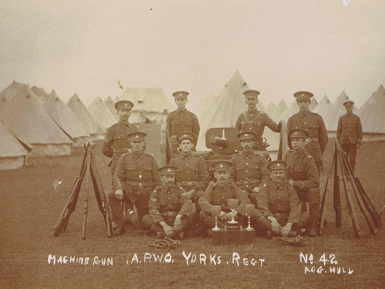 The 5th Territorial Force Battalion, group photo of Machine Gun Co. with trophies, with tents in the background at their annual camp in Bridlington, 4th-8th July 1908