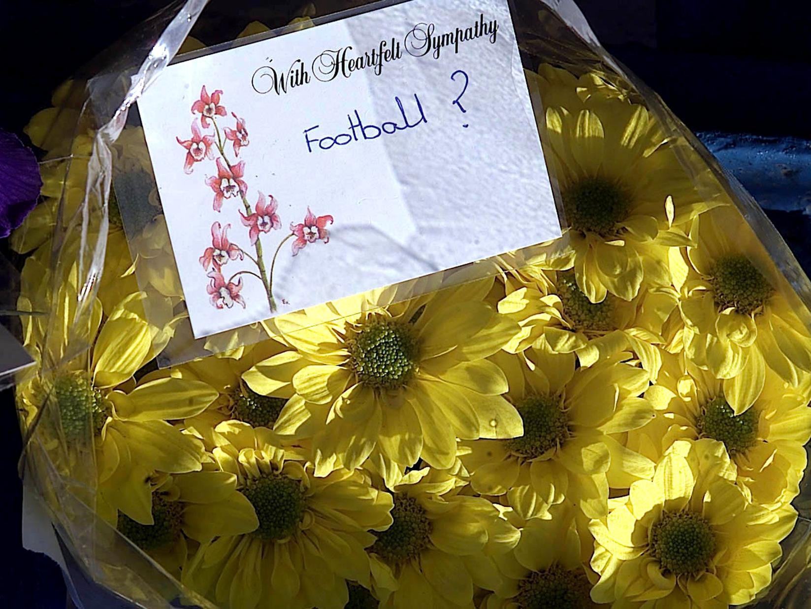 A poignant message on a floral tribute for Kevin Speight and Christopher Loftus the two Leeds United fans killed in Istanbul ahead of their sides UEFA cup match against Galatasaray.