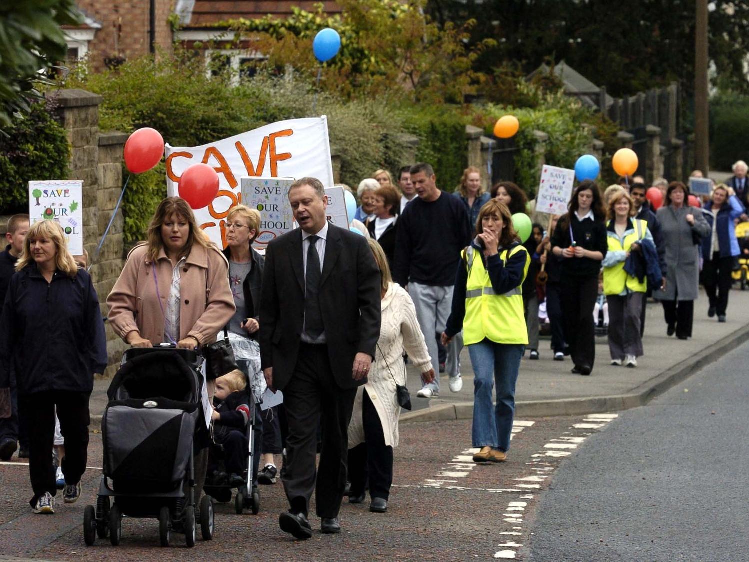 Pupils and parents from Rodley Primary march in protest against the proposed closure of the school.