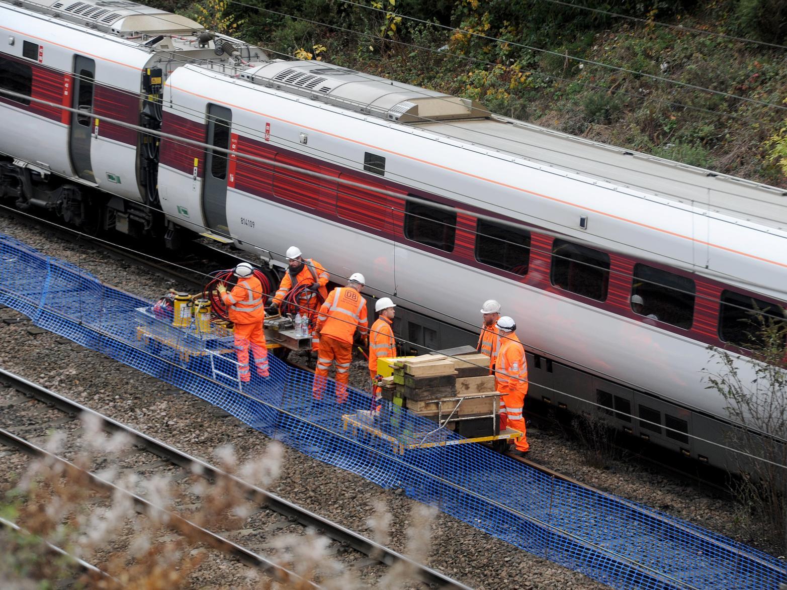 Engineers working on the derailed train.