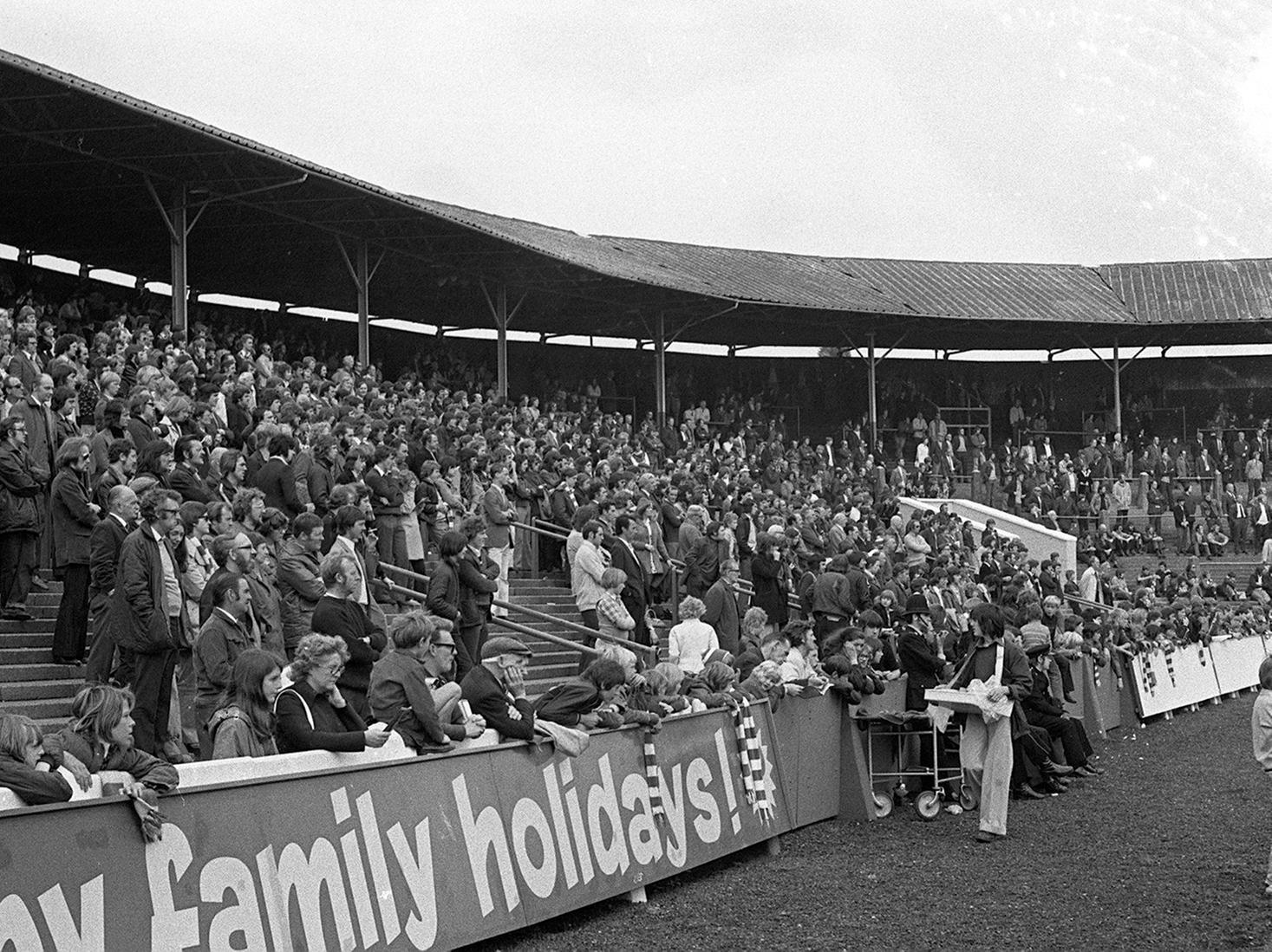 PNE fans watch a game against Walsall in 1974 from the old Spion Kop at Deepdale