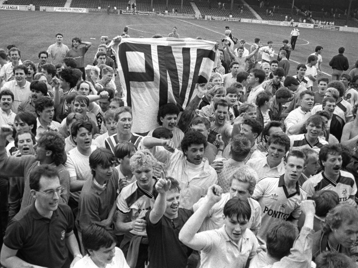Preston fans celebrate on the pitch at Brisbane Road in April 1987 after PNE clinch promotion with victory over Orient