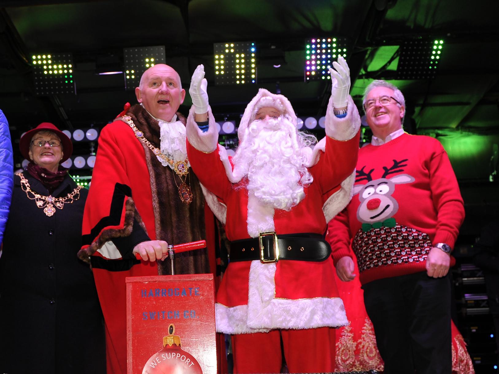 The Mayor of the Borough of Harrogate, Coun Stuart Martin, switches on the Christmas lights with Father Christmas.