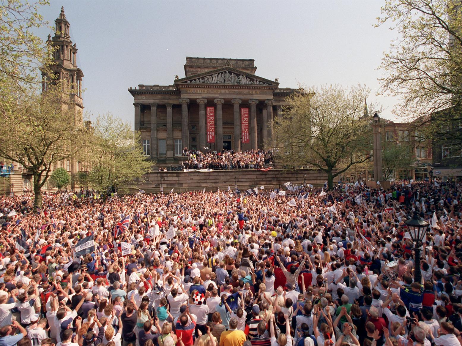 PNE supporters celebrate North End's Second Division title victory in May 2000 on the Flag Market