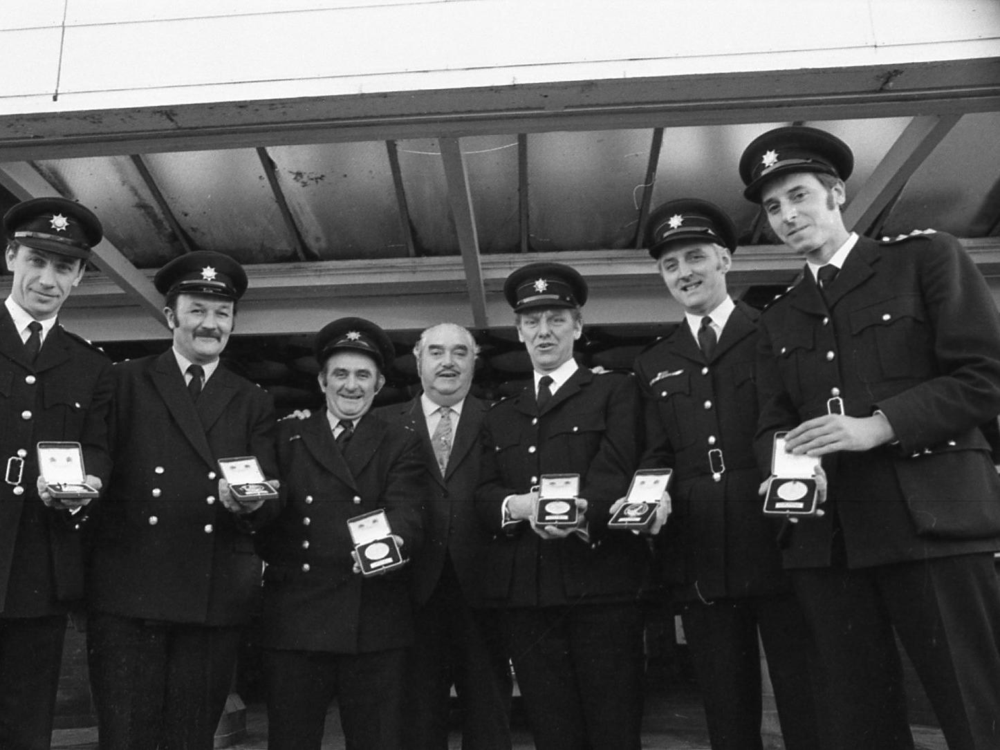 These firemen from St Annes are all holding a medal, They were presented with the accolades at the station on November 30.  What were the medals for?