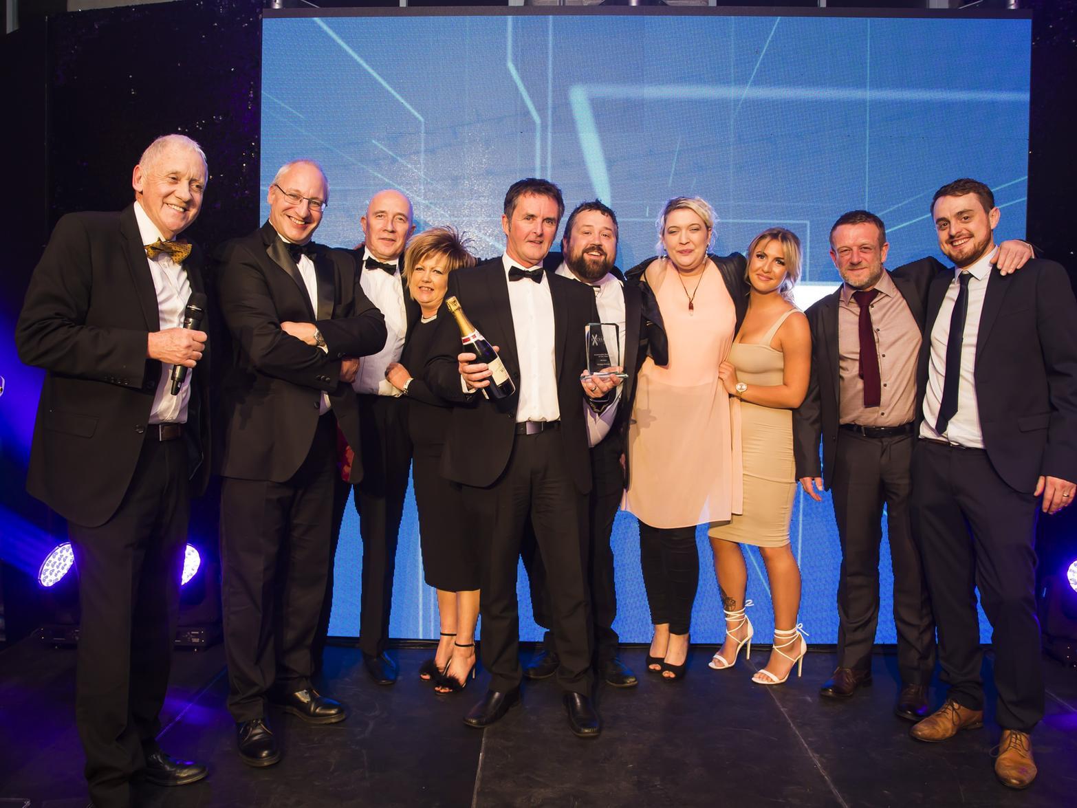 Sustainable Business of the Year. From the left, host Harry Gration, Halifax Courier deputy editor Chris Lever and winners the Eclipse Energy team.