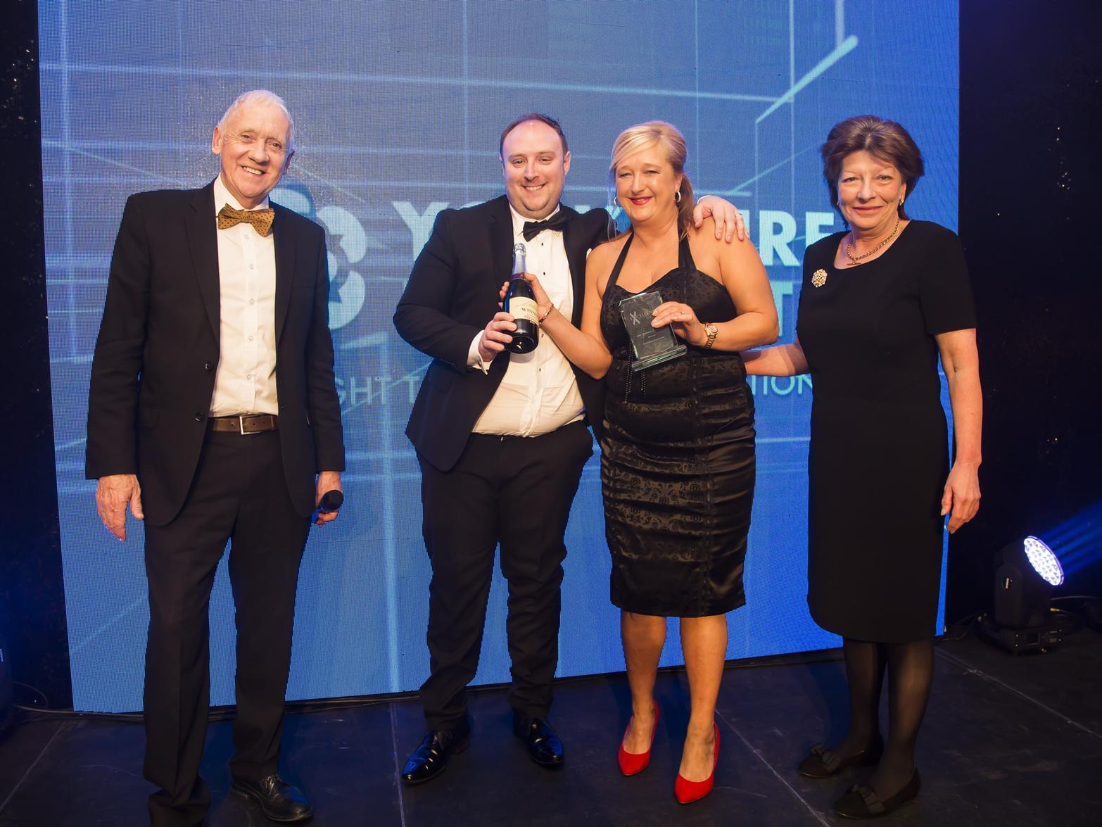 SME Business of the Year. From the left, host Harry Gration, winners James Howard and Teresa Whyte from Yorkshire Payments and Halifax Courier group editor Jeam MacQuarrie.