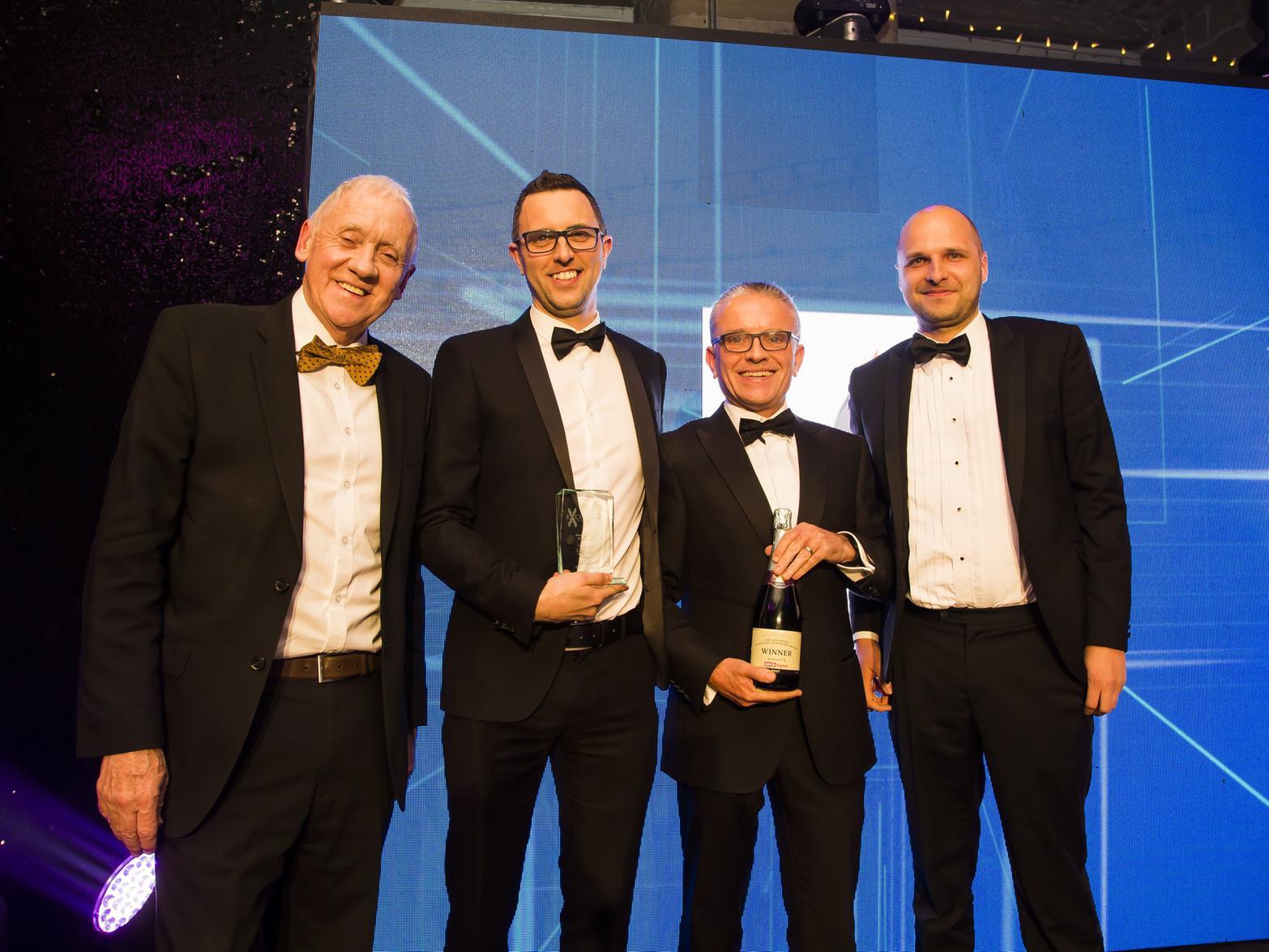 New Business of the Year - Candle Digital. From the left, host Harry Gration, Andy Jack from Candle Digital, Sponsor Robin Tuddenham from Calderdale Council and Mark Langdale from Candle Digital.