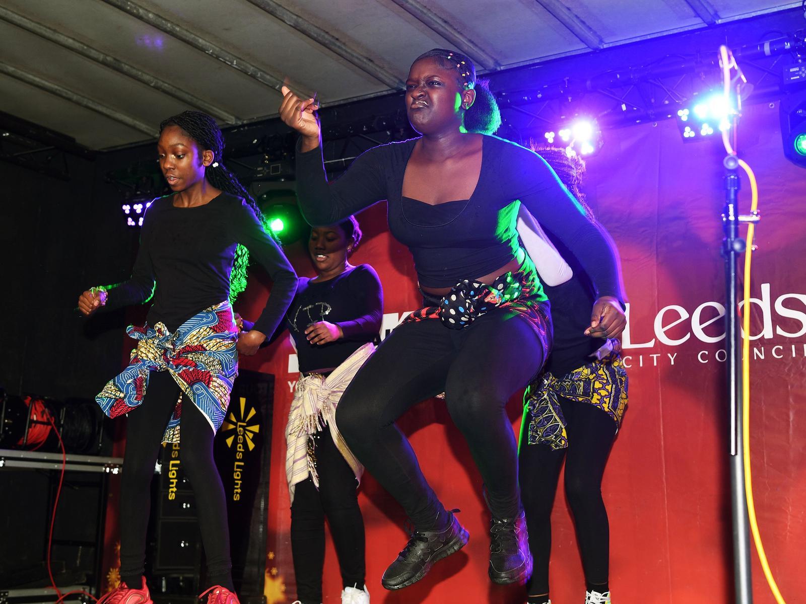 Afro Angels perform on stage.