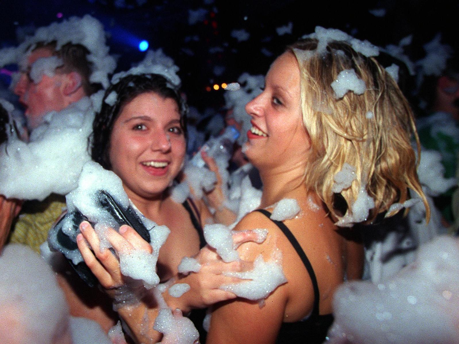 Smile for the camera! Revellers enjoy the foam party.