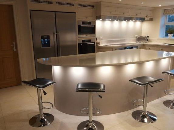 A central island and breakfast bar is the feature of this spacious kitchen.