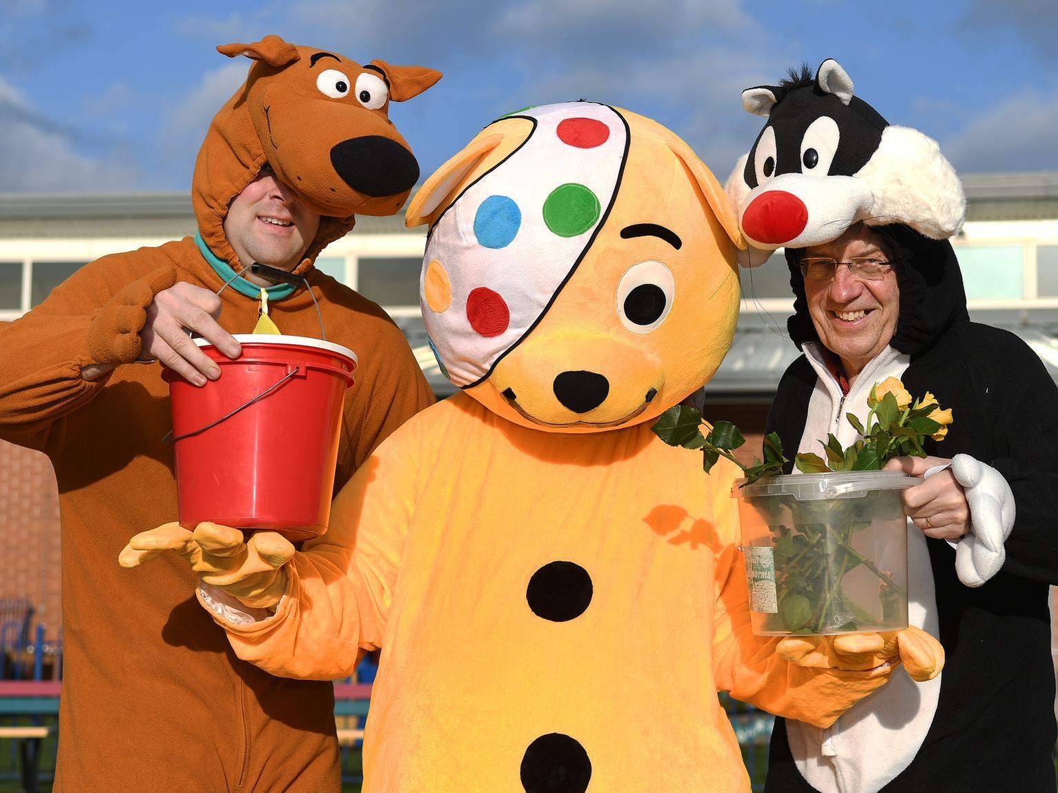 Bridlington Round Table doing there bit for Children in Need by going to all the primary schools in Bridlington and district dressed as Pudsey Bear and well known cartoon characters. PA1946-7a