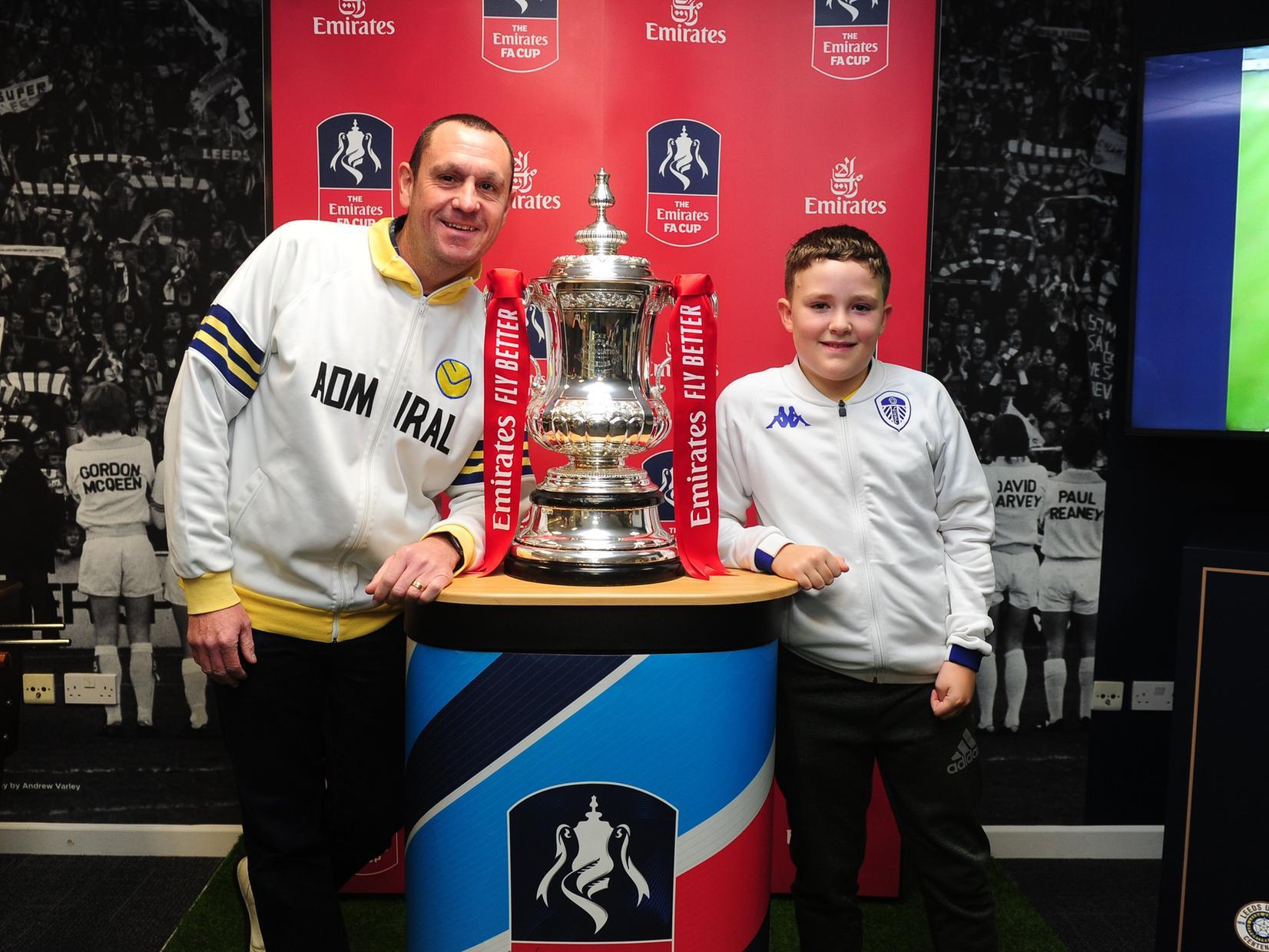 Lee McKone with his son Theo Mckone, aged 10, pictured with the cup