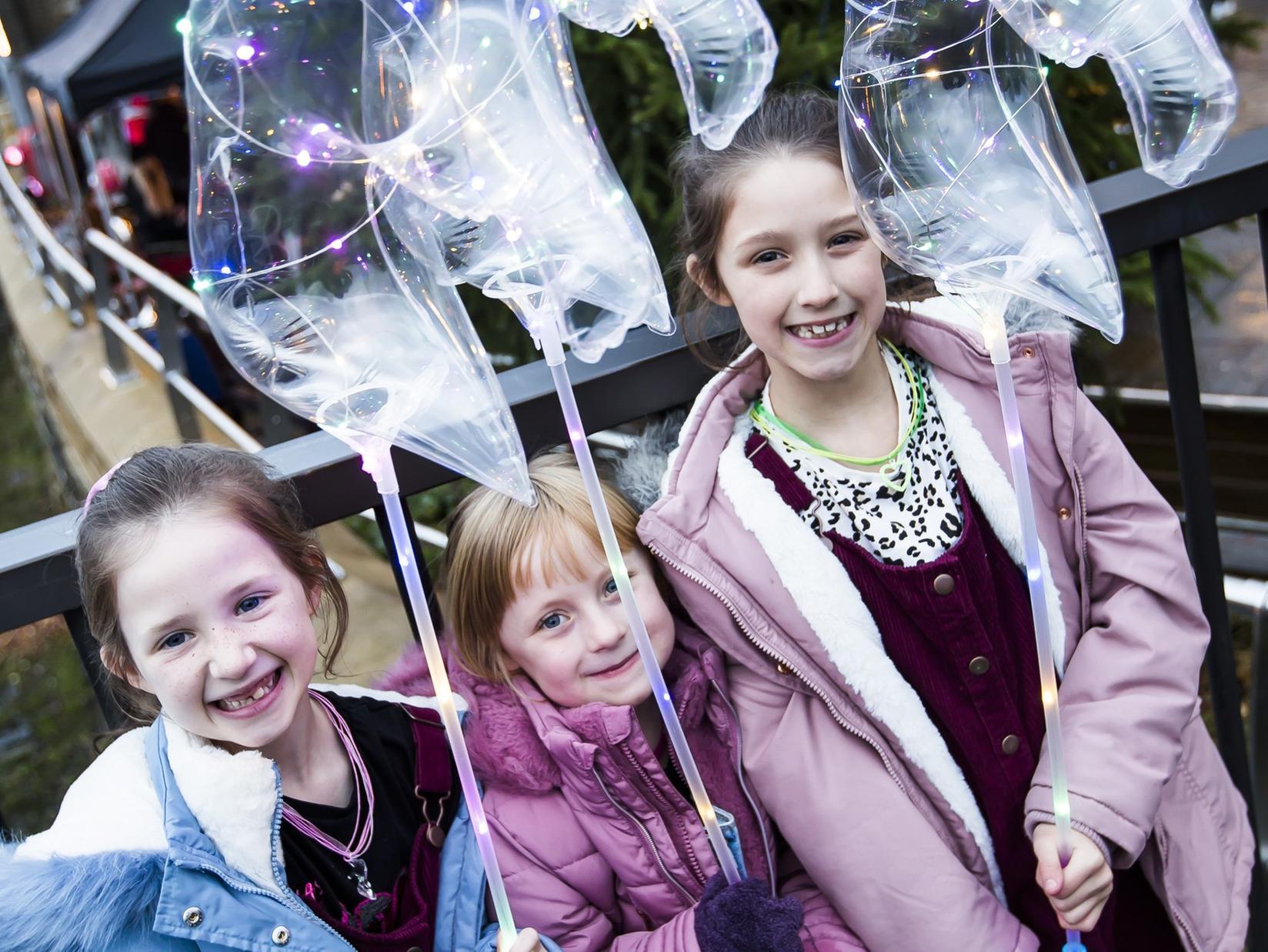 Isabelle Knight, seven, Phoebe Stafford, seven, and Olivia Knight, eight, having fun at the village event.