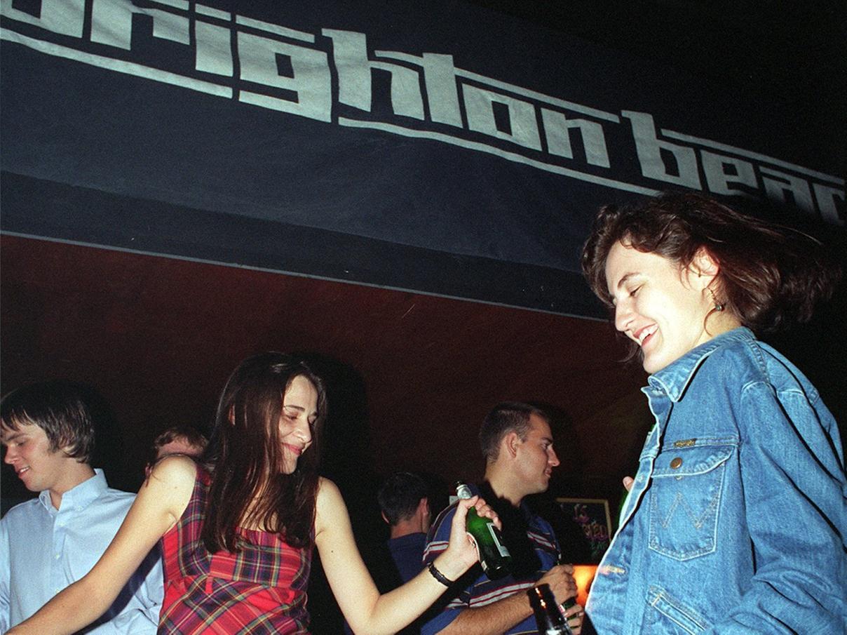 Clubbers, bottle in hand, enjoy Britpop classics. Were you one of them?