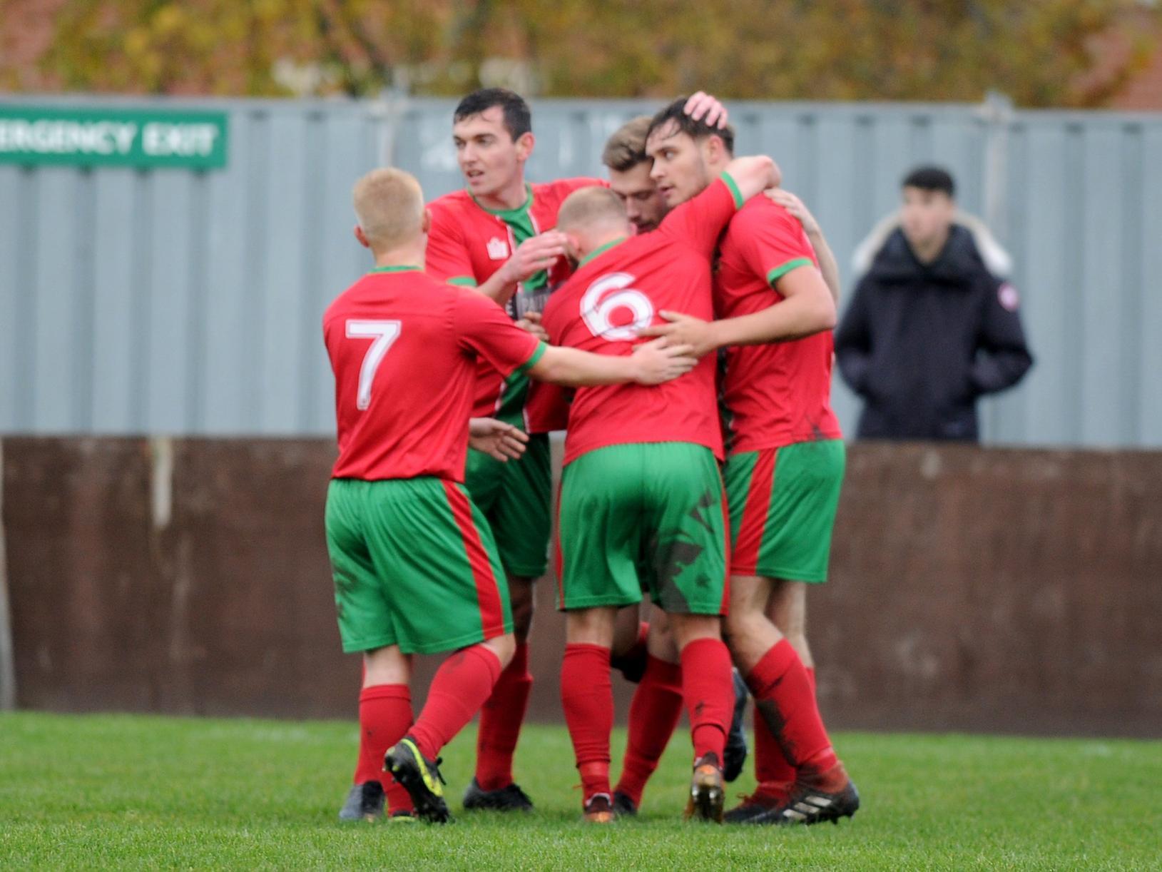 The Railway players celebrate after going 1-0 up at Station View.